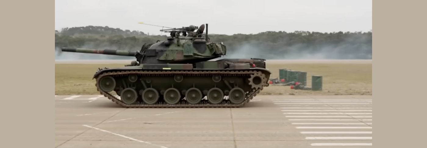 Military tank in motion during a training exercise, illustrating U.S. weapons support for Taiwan amid rising tensions with China.