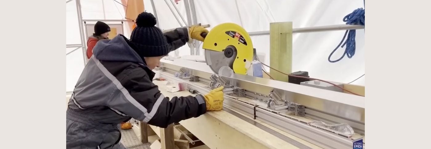 Scientists examine an ancient ice core in Antarctica.